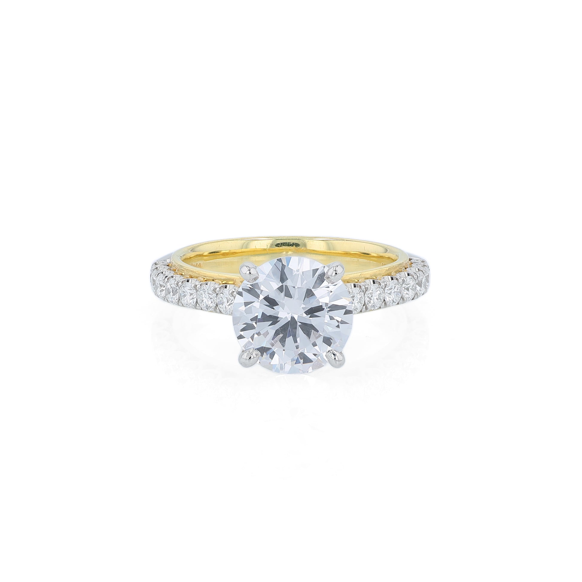 Two-tone diamond engagement ring with diamond accents and a round cubic zirconia center on a white background