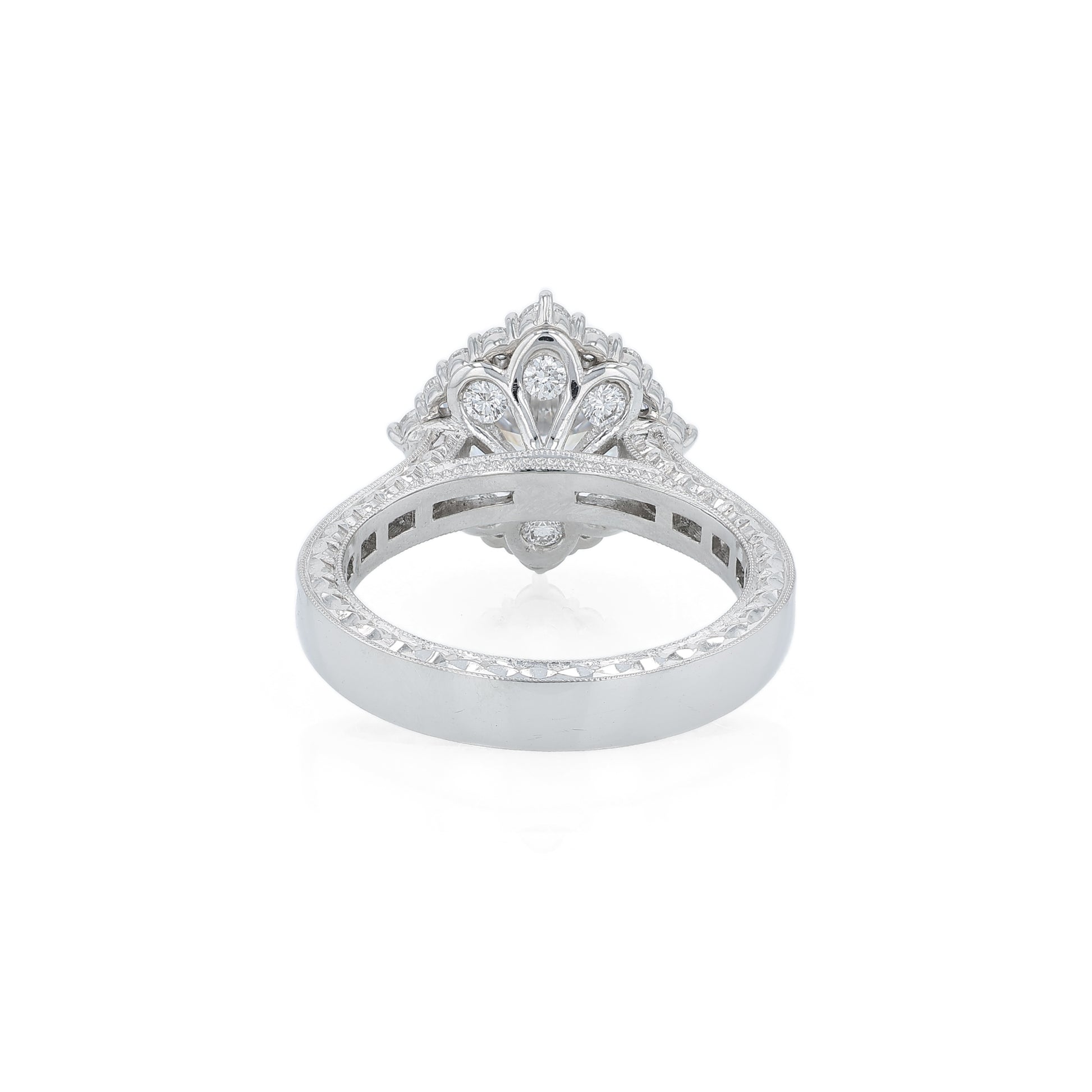 Platinum diamond halo engagement ring with diamond accents and a round cubic zirconia center on a white background