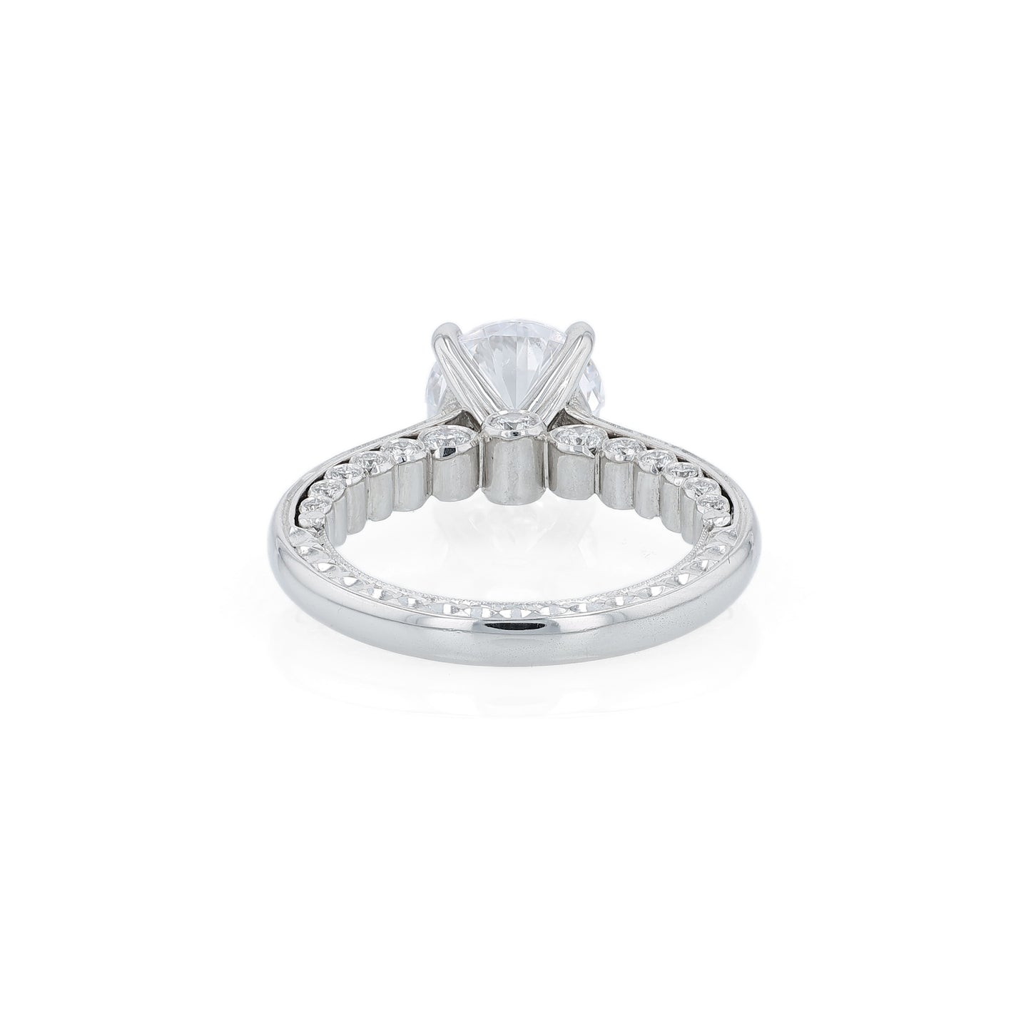 Platinum diamond engagement ring with diamond accents a round cubic zirconia center on a white background