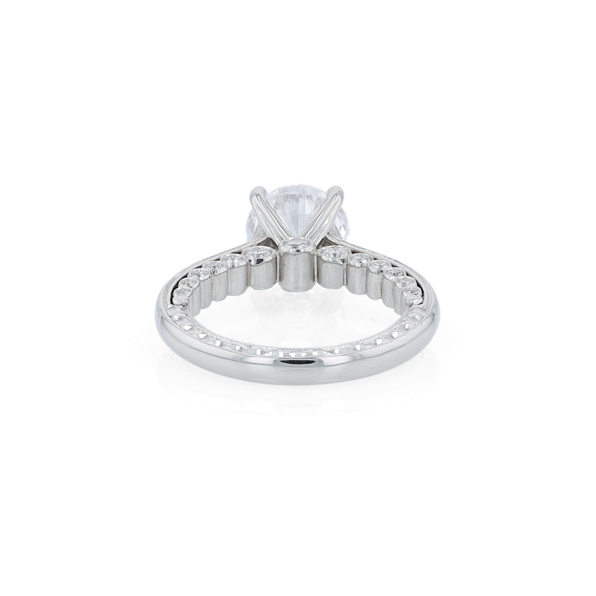 Platinum diamond engagement ring with diamond accents a round cubic zirconia center on a white background