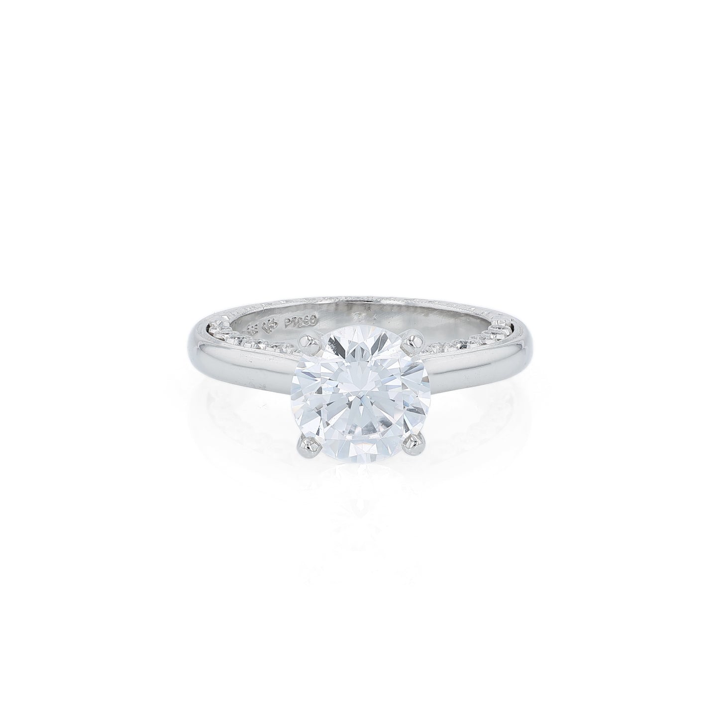 Platinum diamond engagement ring with diamond accents a round cubic zirconia center on a white background