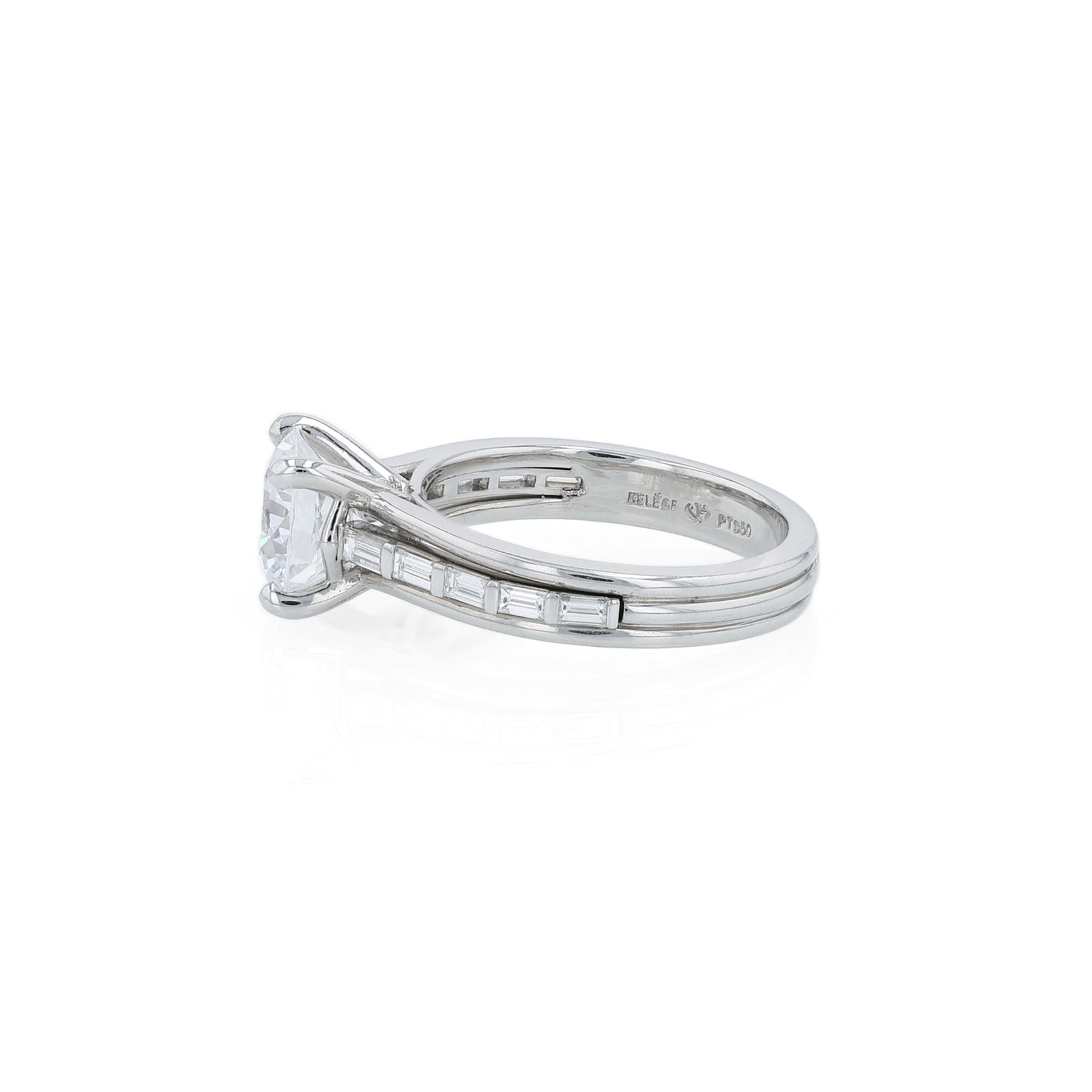 Platinum diamond engagement ring with baguette diamond accents a round cubic zirconia center on a white background