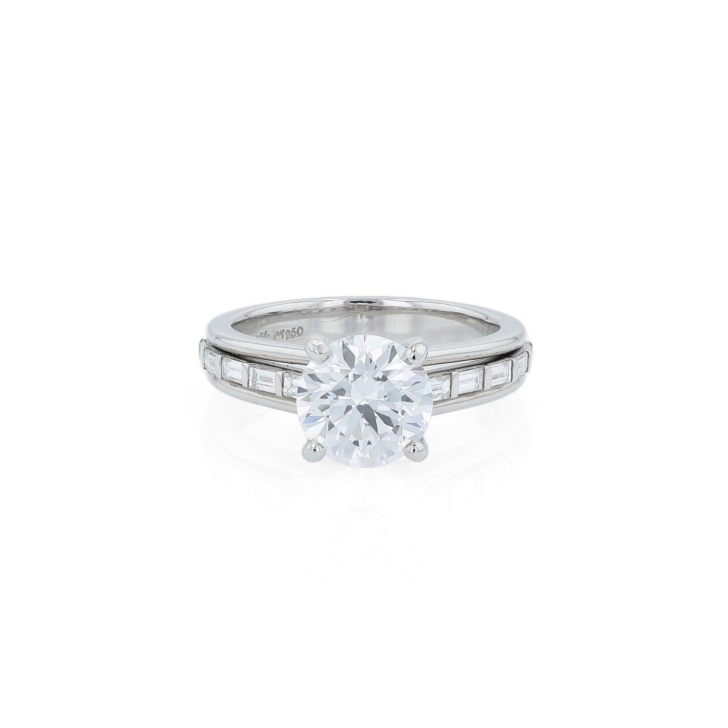 Platinum diamond engagement ring with baguette diamond accents a round cubic zirconia center on a white background