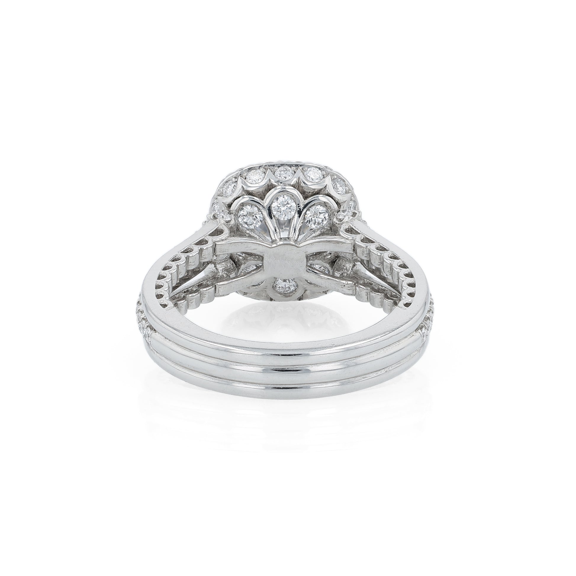 Platinum diamond halo engagement ring with diamond accents and a round cubic zirconia center on a white background