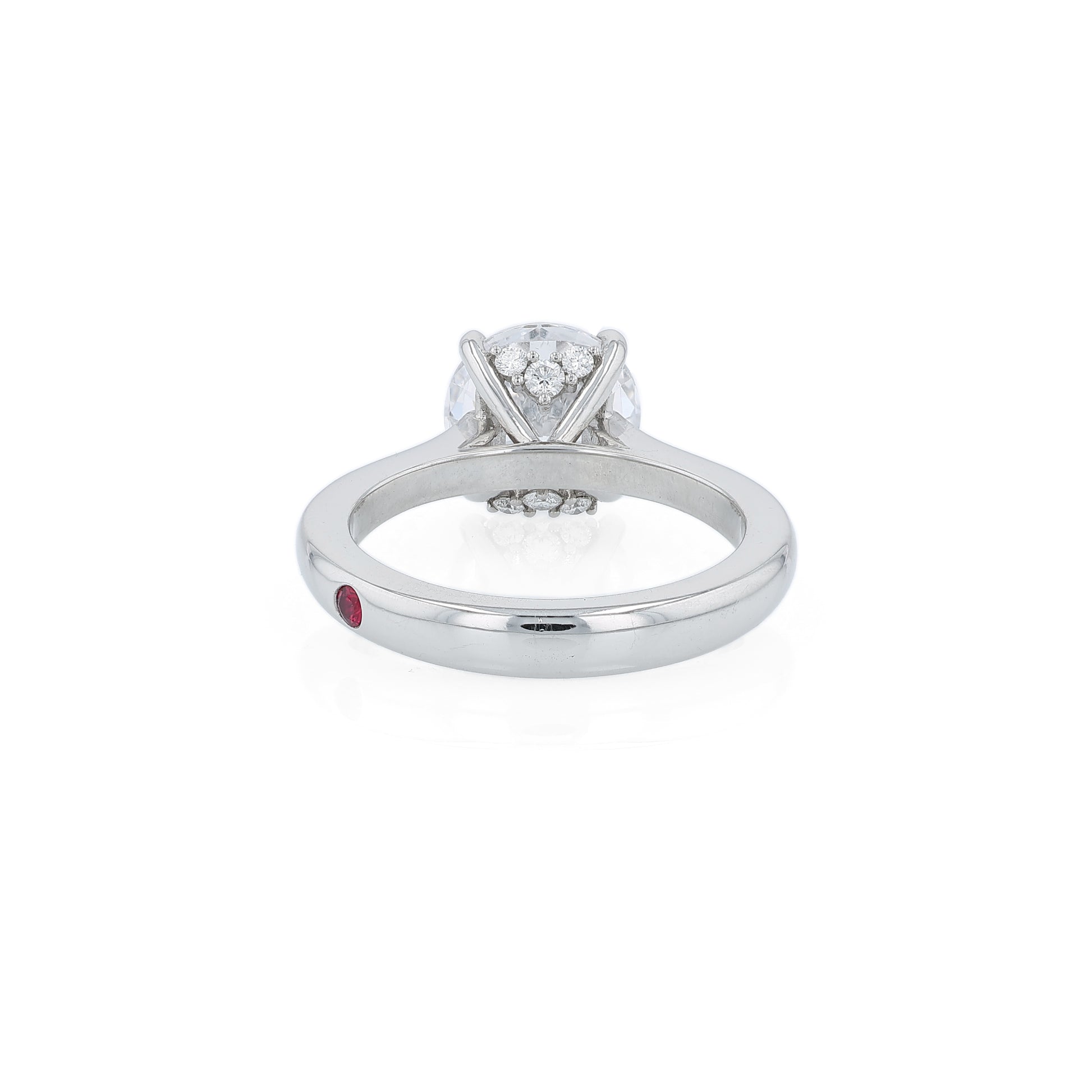 Platinum diamond solitaire engagement ring with a round cubic zirconia center on a white background