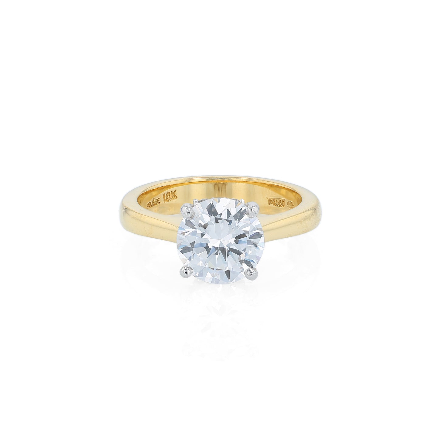 Yellow gold and platinum diamond solitaire engagement ring with diamond accents and a round cubic zirconia center on a white background