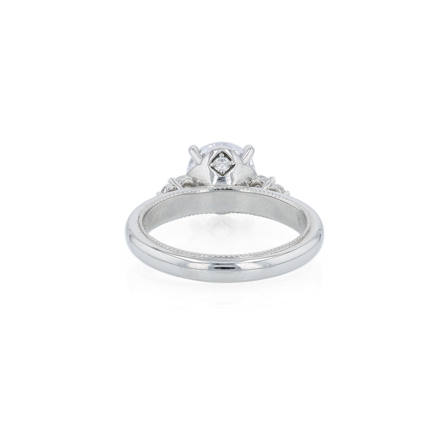 Platinum diamond engagement ring with diamond accents and a round cubic zirconia center on a white background