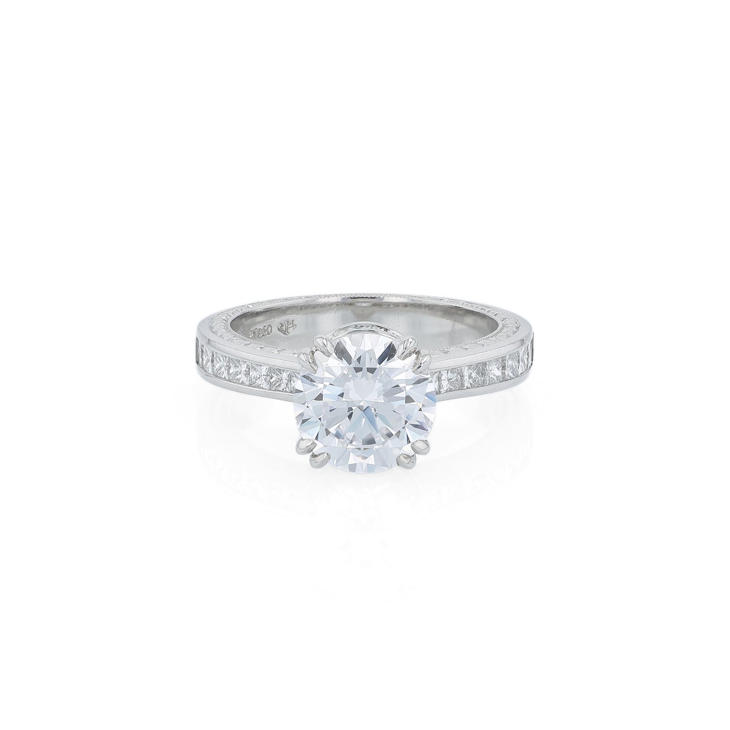 Platinum diamond engagement ring with diamond accents and a round cubic zirconia center on a white background