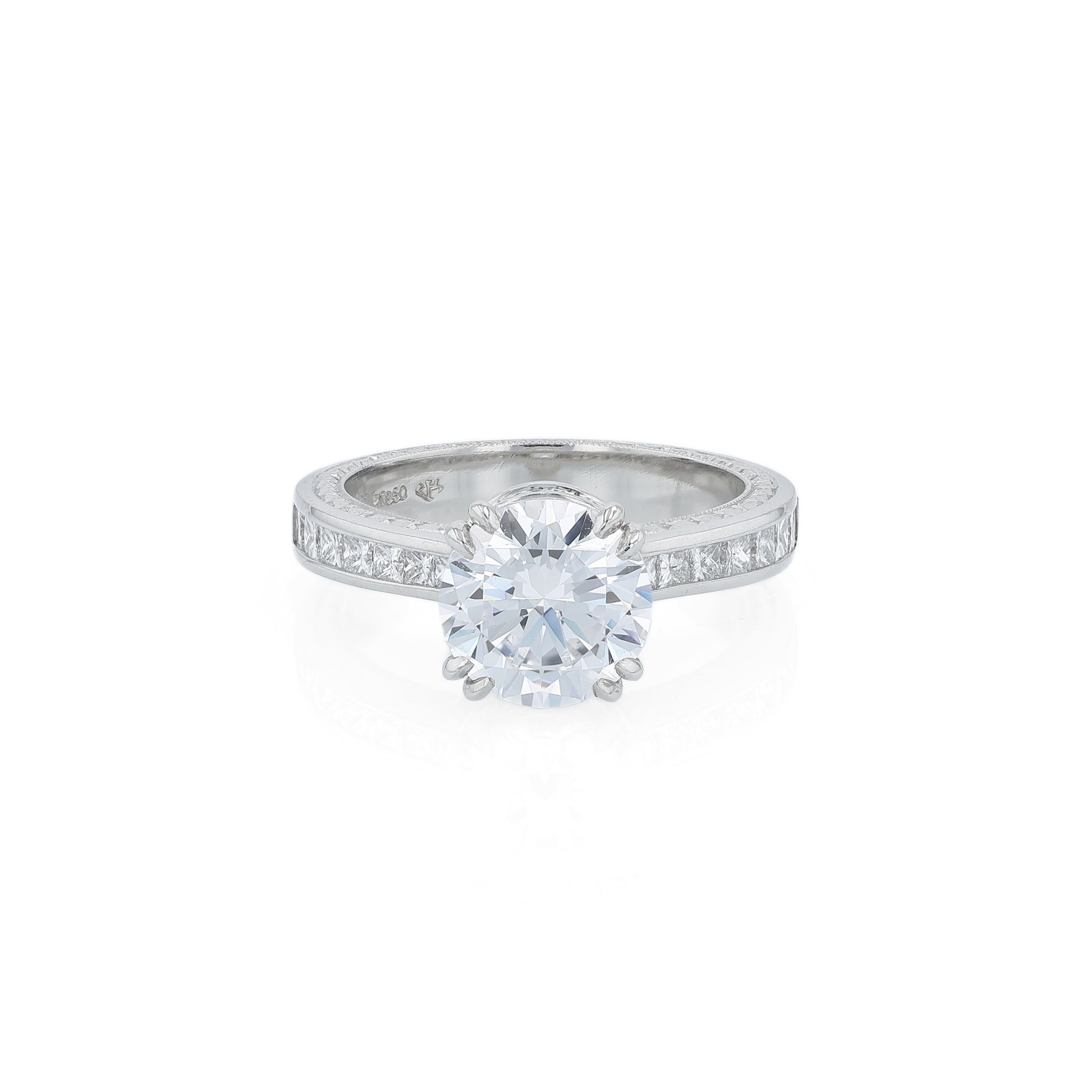 Platinum diamond engagement ring with diamond accents and a round cubic zirconia center on a white background