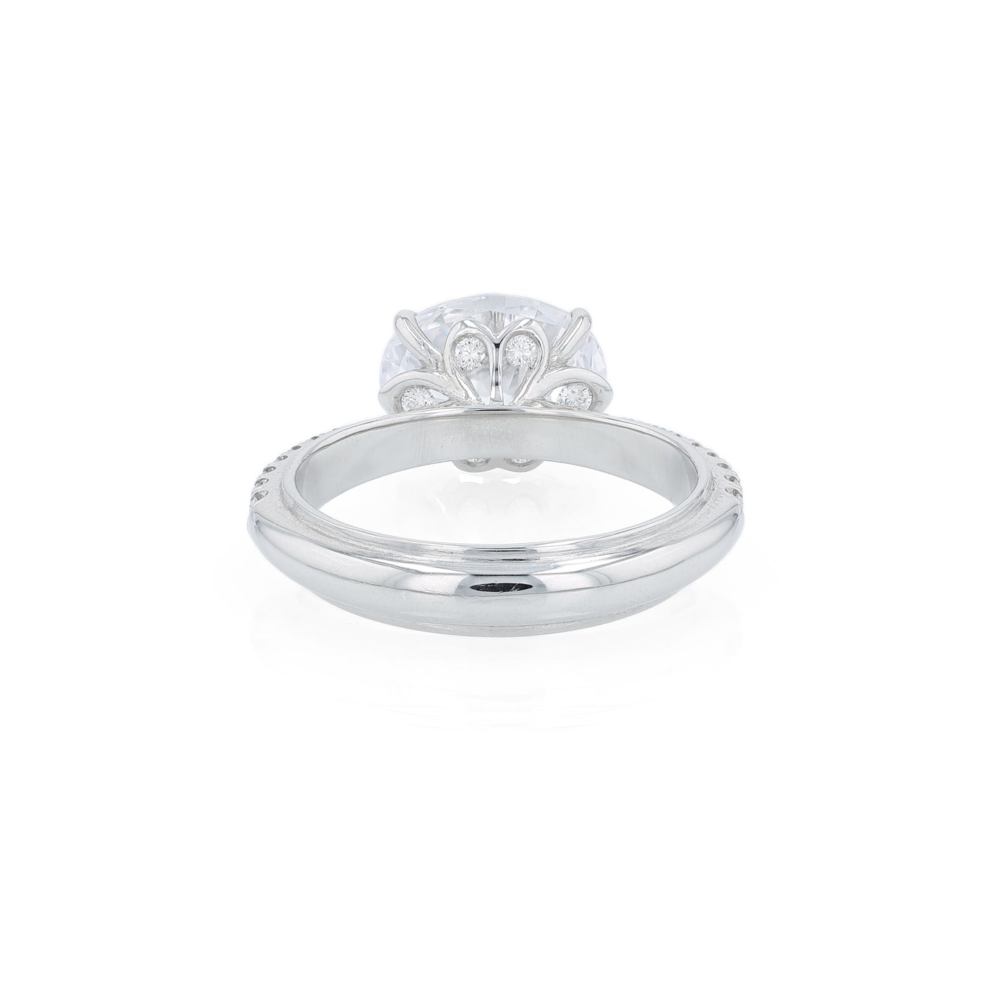 Platinum diamond engagement ring with diamond accents and an oval cubic zirconia center on a white background