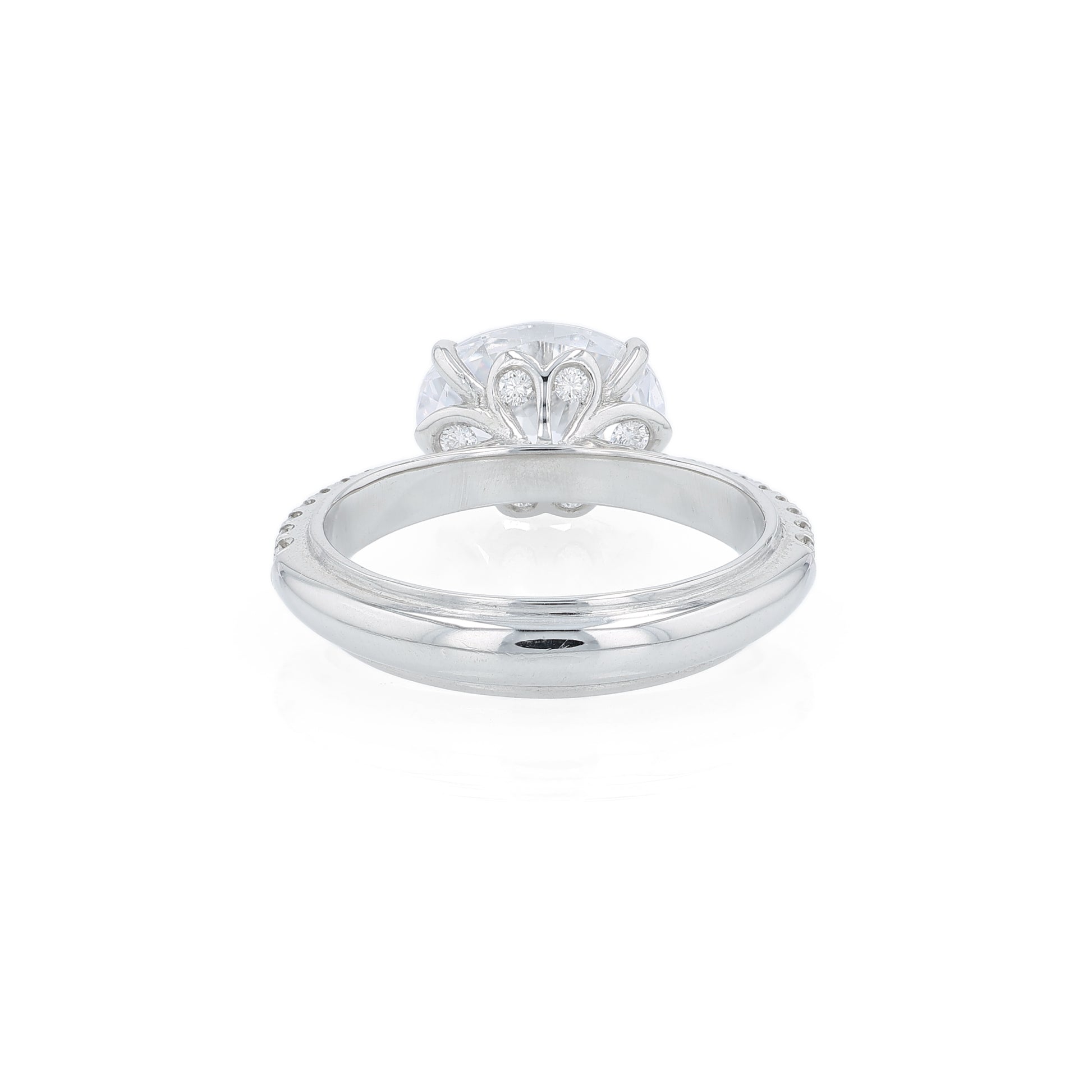 Platinum diamond engagement ring with diamond accents and an oval cubic zirconia center on a white background