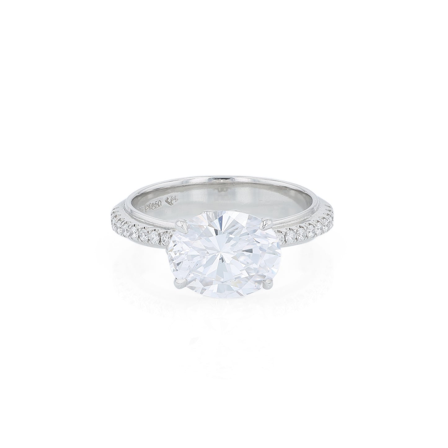 Platinum diamond engagement ring with diamond accents and an oval cubic zirconia center on a white background