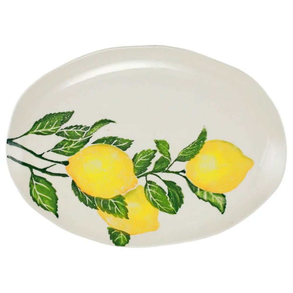 Medium Oval Platter with lemons and green leaves on white background. 
