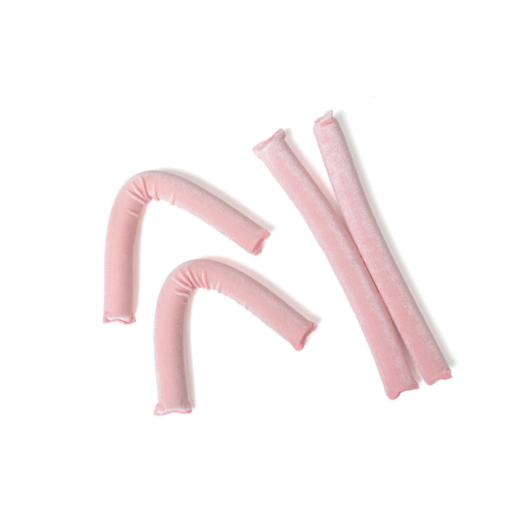 Set of pink foam pool noodles on a white background