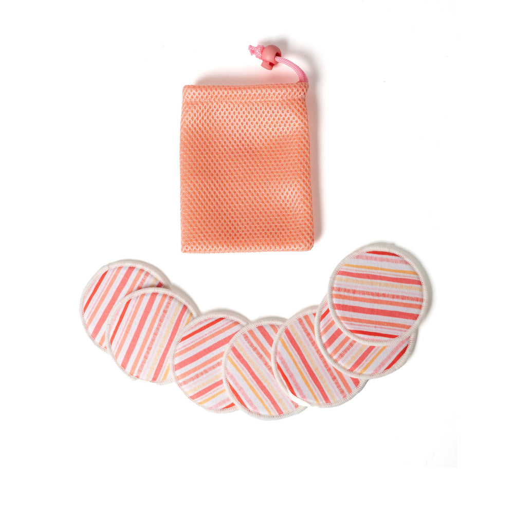 Set of pink and white striped face pads with a mesh bag on a white background