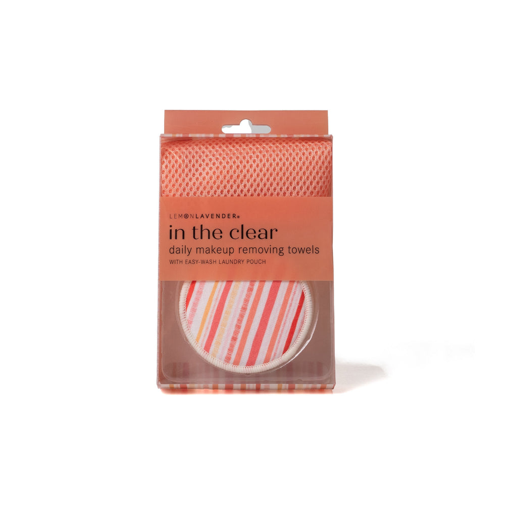 Packaged makeup removing towels with a clear and striped design on a white background