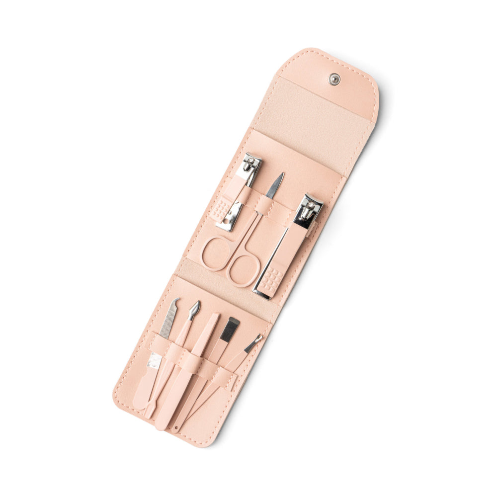 Manicure set with tools in a coral case on a white background