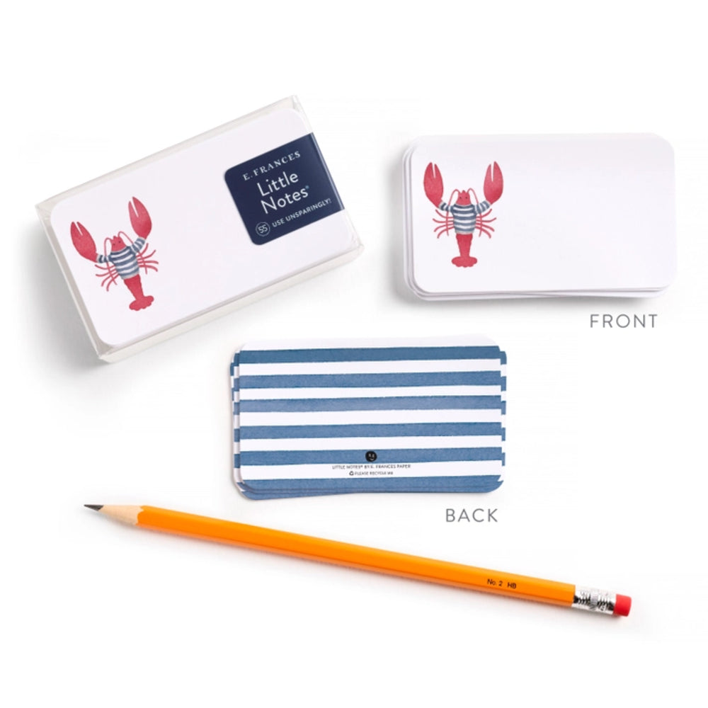 Note card set with lobster design, pencil, and striped cover on a white background.