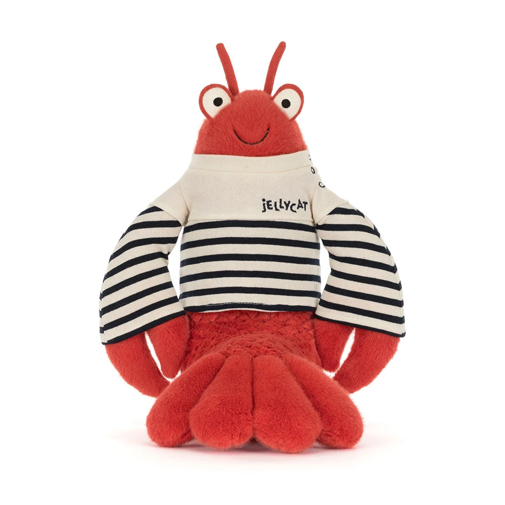 A stuffed animal red lobster in a sailor outfit with a white & blue striped shirt that says "Jellycat" in the upper left hand corner in blue on a white backround 