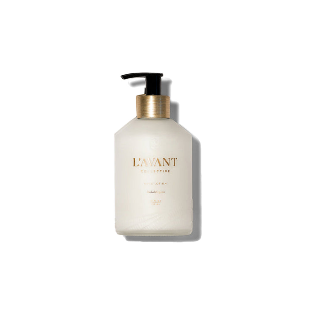 A frosted glass pump bottle of Lavant Collective Shea Lotion in Shea Butter, featuring a black pump and a metallic gold collar, set against a solid white background with a soft shadow.