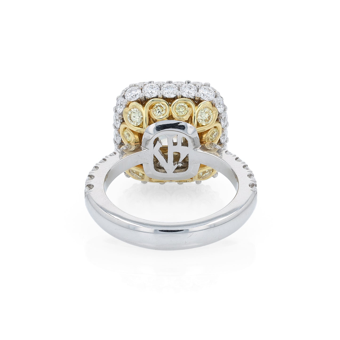 Platinum diamond halo ring with a yellow diamond center on a white background