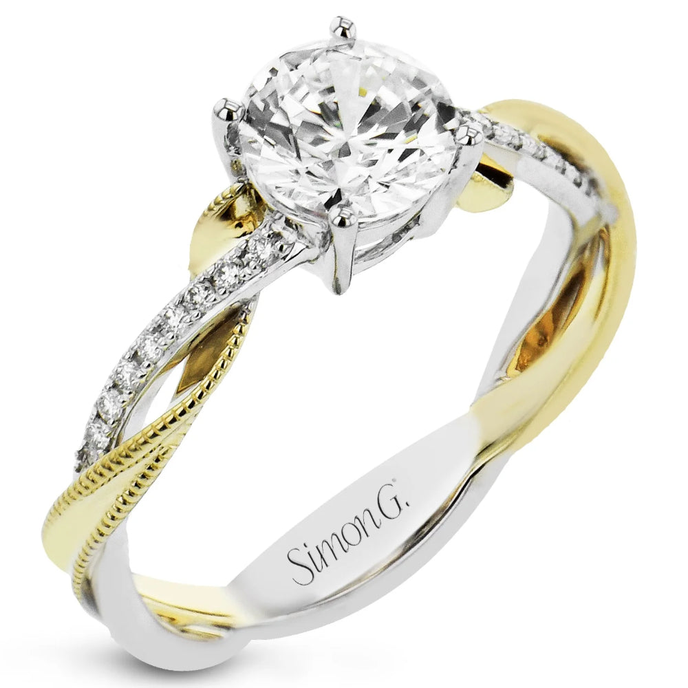 Two-tone diamond ring with 'Simon G.' engraving on a white background