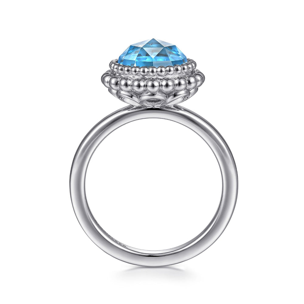 Silver ring with a Bezel set blue Topaz 