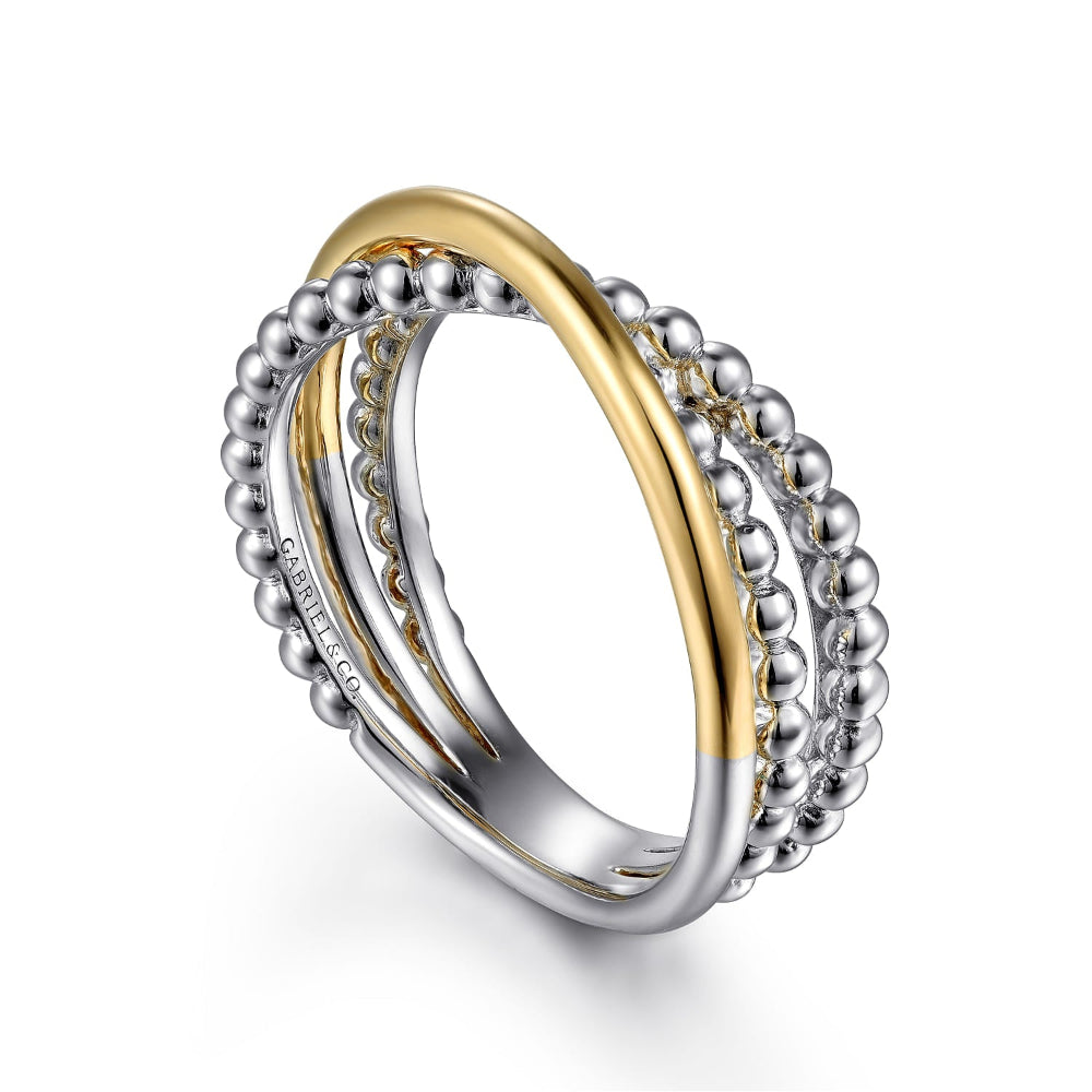Two gold and silver rings twisted together 