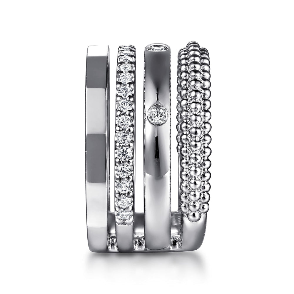 One ring with 4 bands of Sterling Silver and white sapphires 