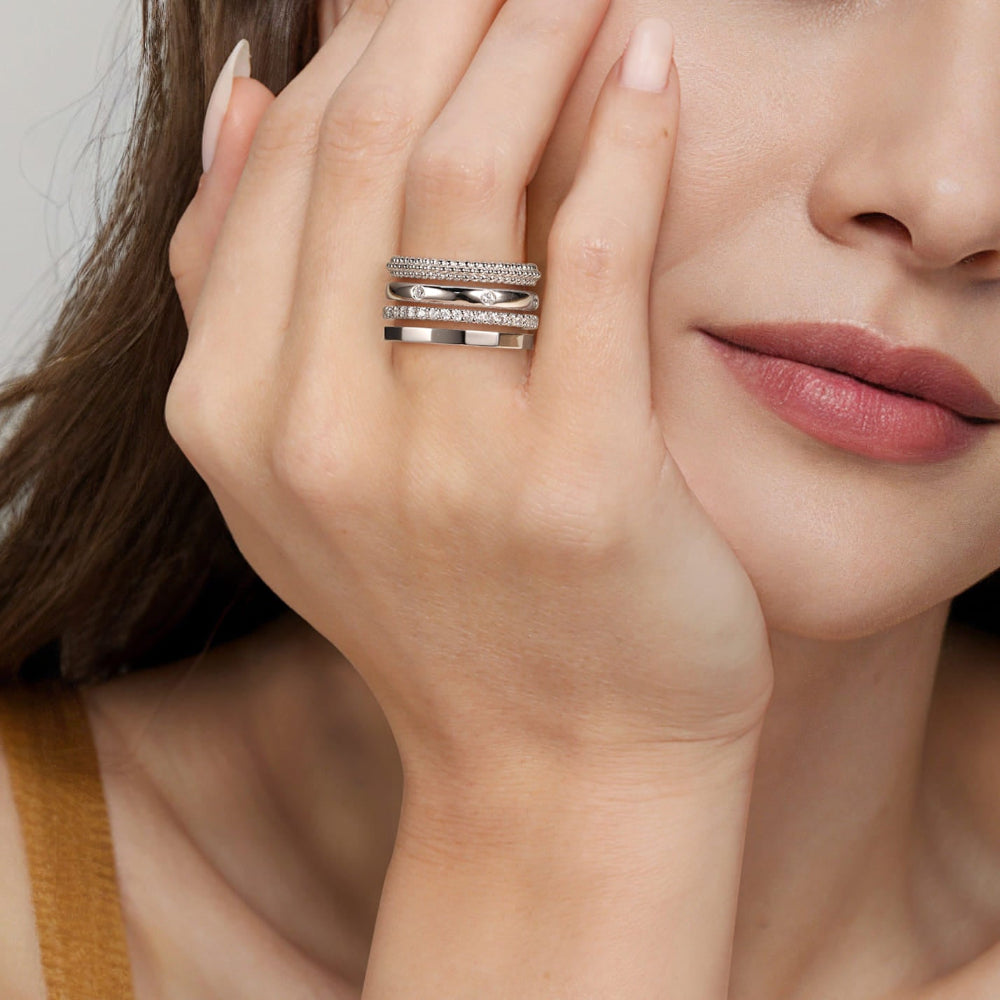 Close-up of a woman's hand wearing Sterling Silver and White Sapphire Stackable ring 