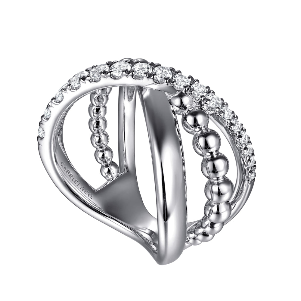 Silver ring with beaded design and white sapphires