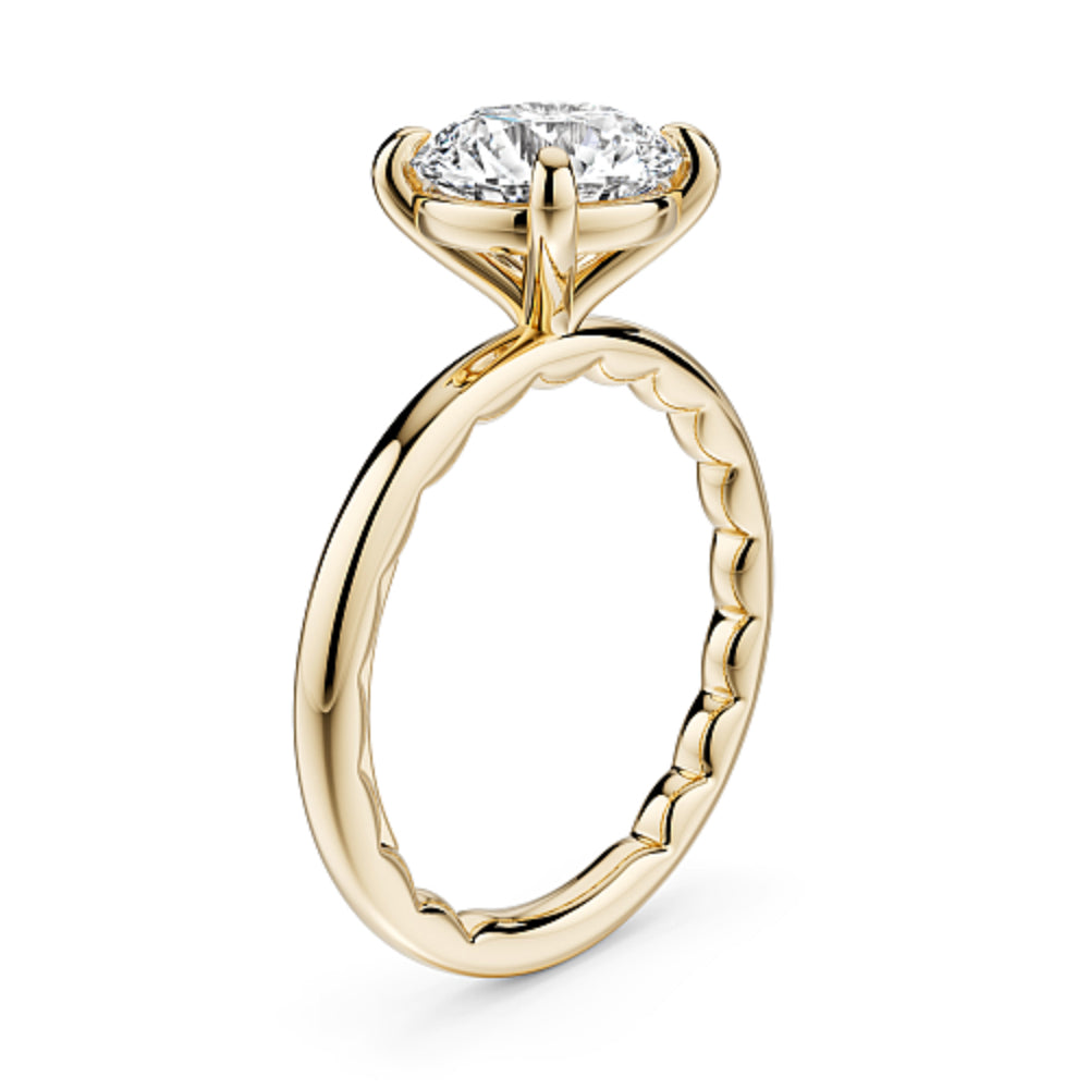 Gold Noam Carver ring with a large round diamond on a white background