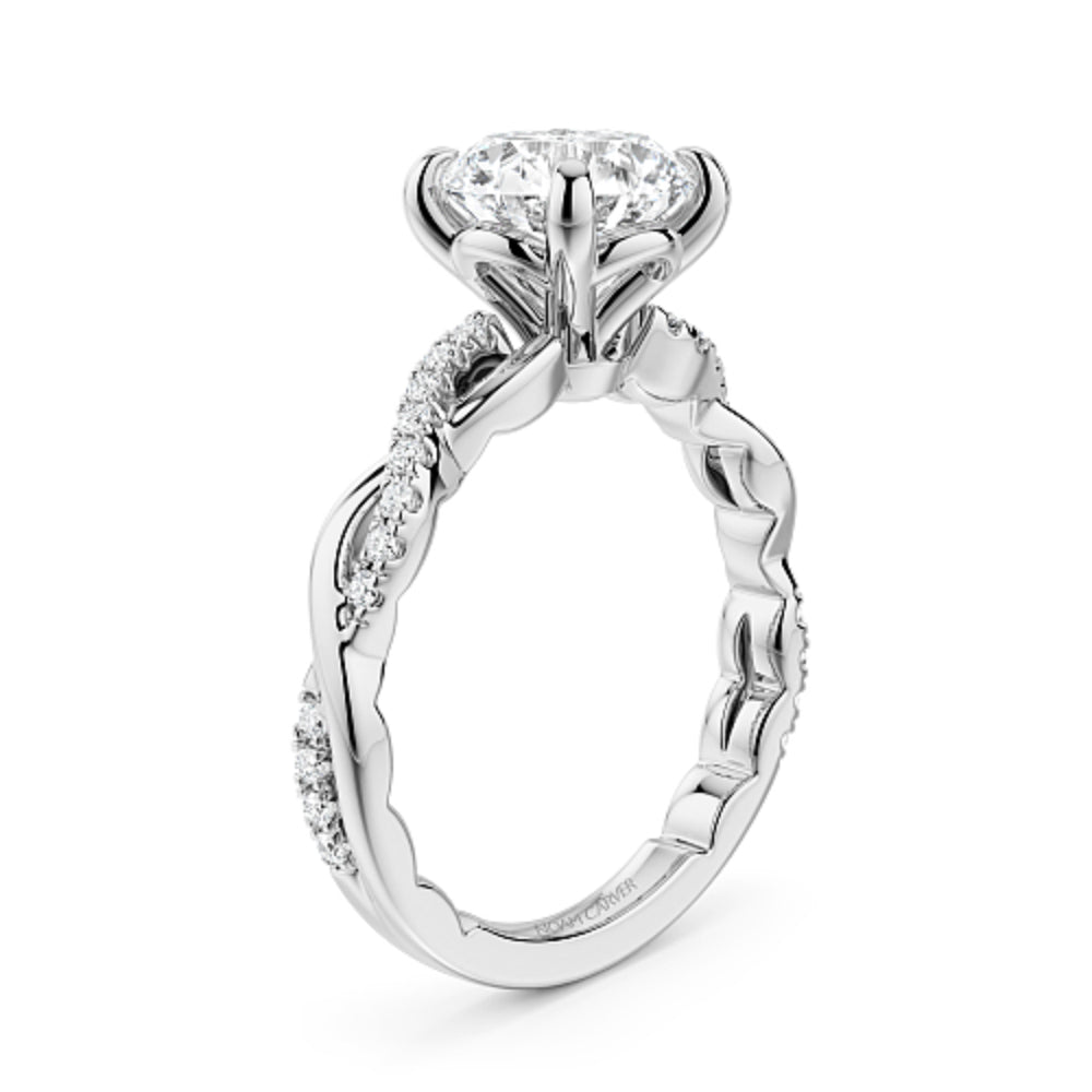 Diamond white gold Noam Carver ring with intricate twist design on a white background