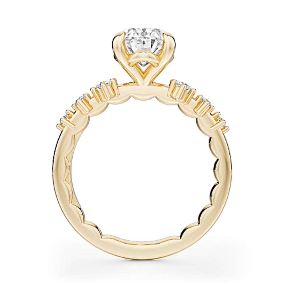 Gold Noam Carver ring with a large oval diamond center and smaller round diamond sides on a white background