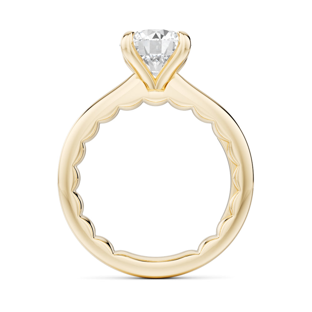 Gold Noam Carver ring with a round diamond on a white background