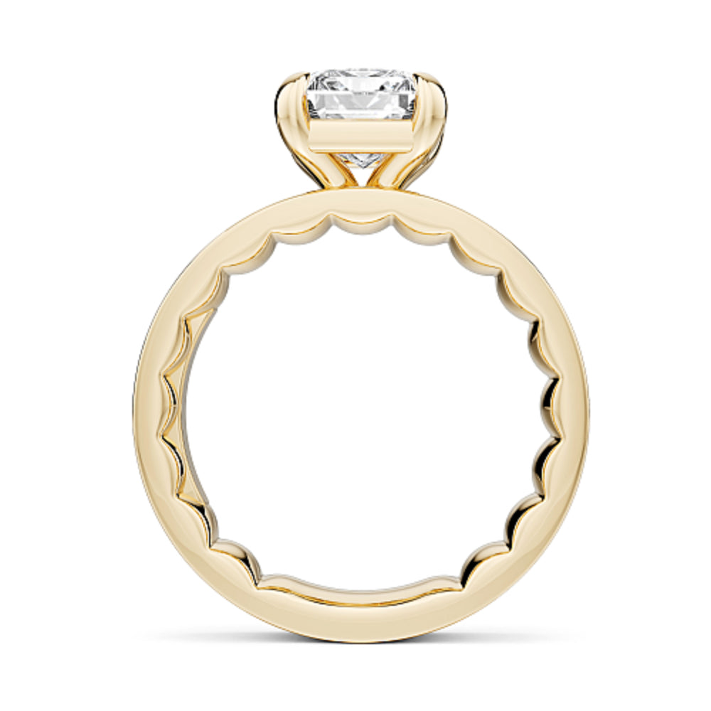 Wide band gold ring with a large emerald cut diamond on a white background