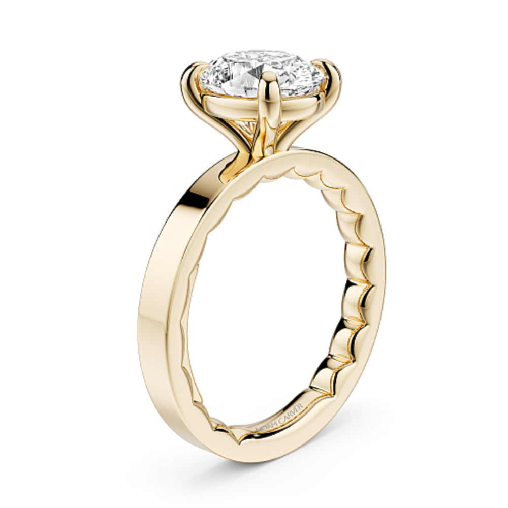 Gold Noam Carver ring with a large oval diamond on a white background