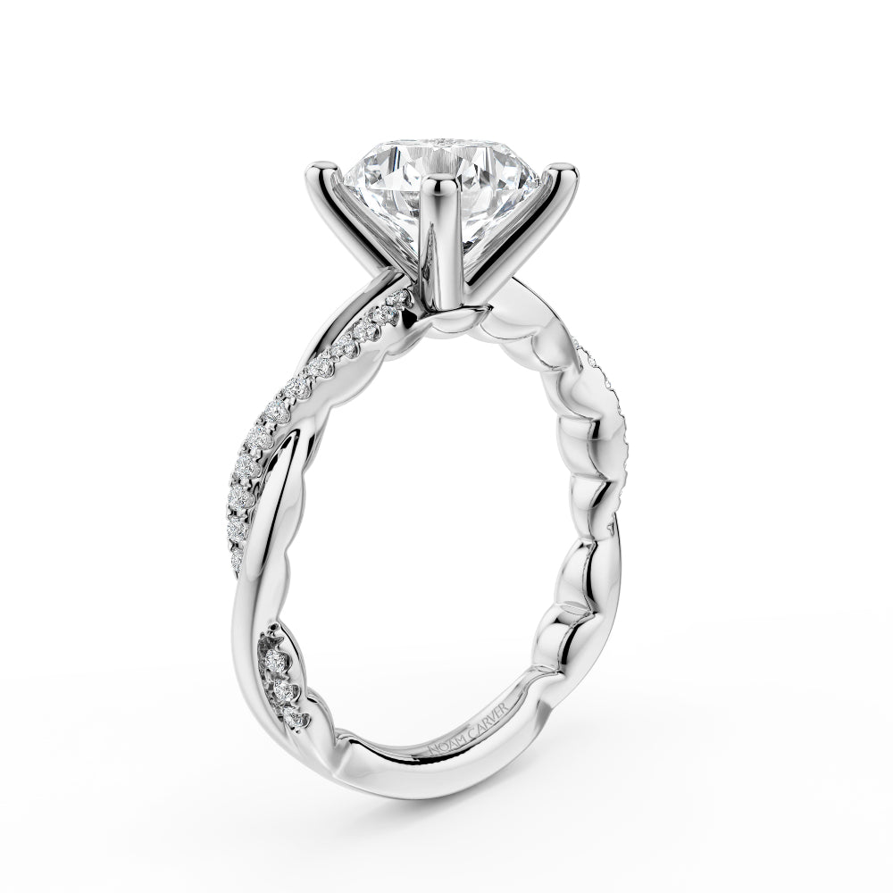 Diamond white gold Noam Carver ring with intricate twist design on a white background
