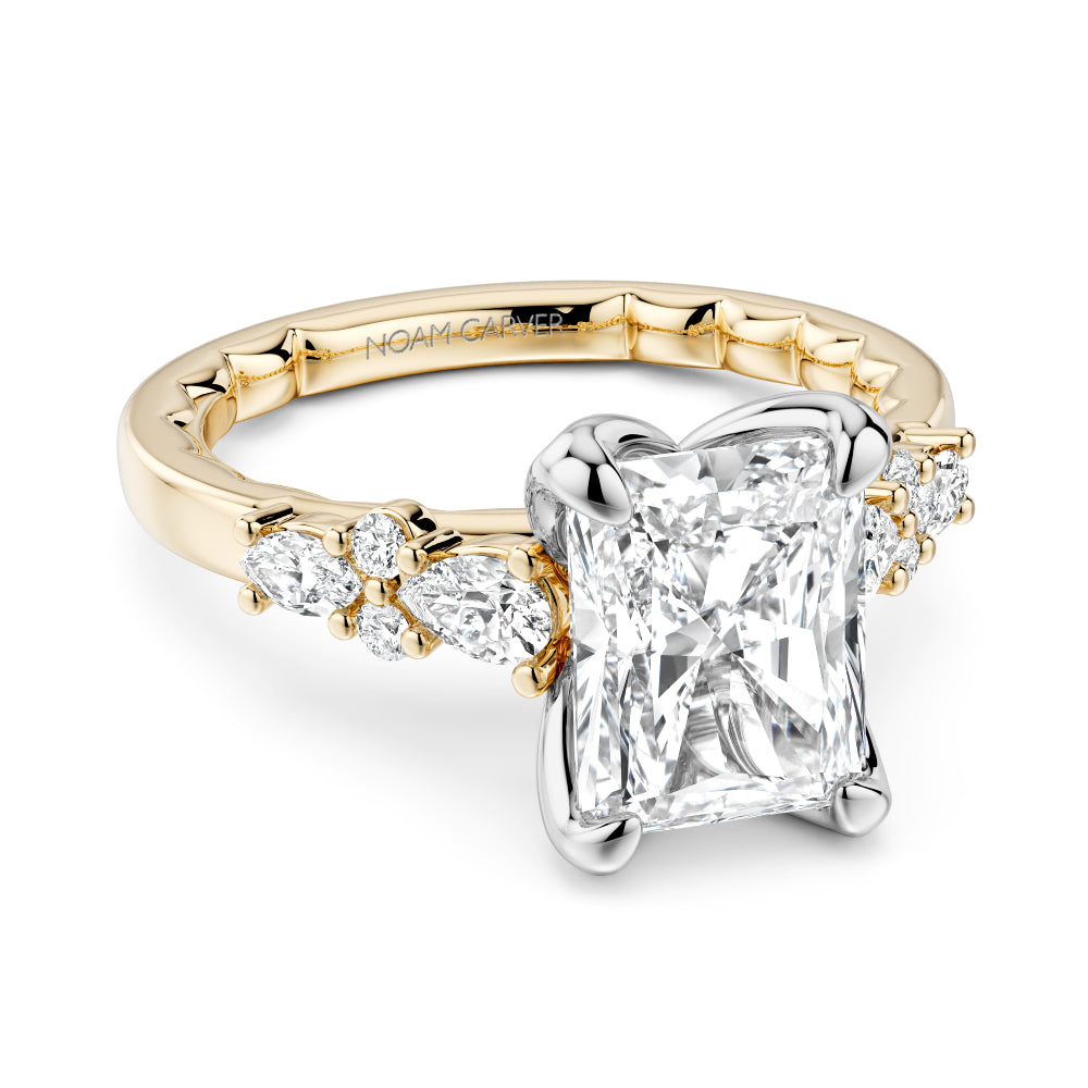 Gold and diamond Noam Carver ring with a radiant cut diamond center on a white background