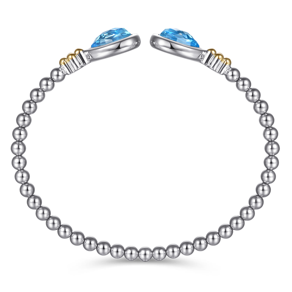 Silver bracelet with blue gemstones on a white background