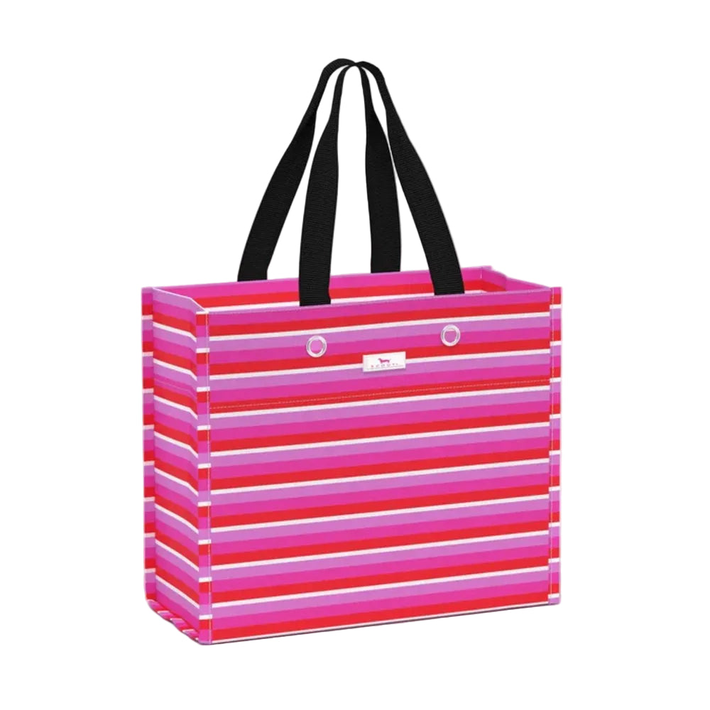 A rectangular tote bag with horizontal pink, magenta, red, and white stripes, featuring black shoulder straps and a small white brand tag on the front.