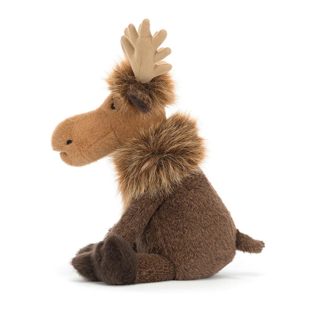 A side of a brown stuffed moose toy sitting on a clean white background. The toy features a warm brown body, a darker brown fluffy neck, and light tan antlers.