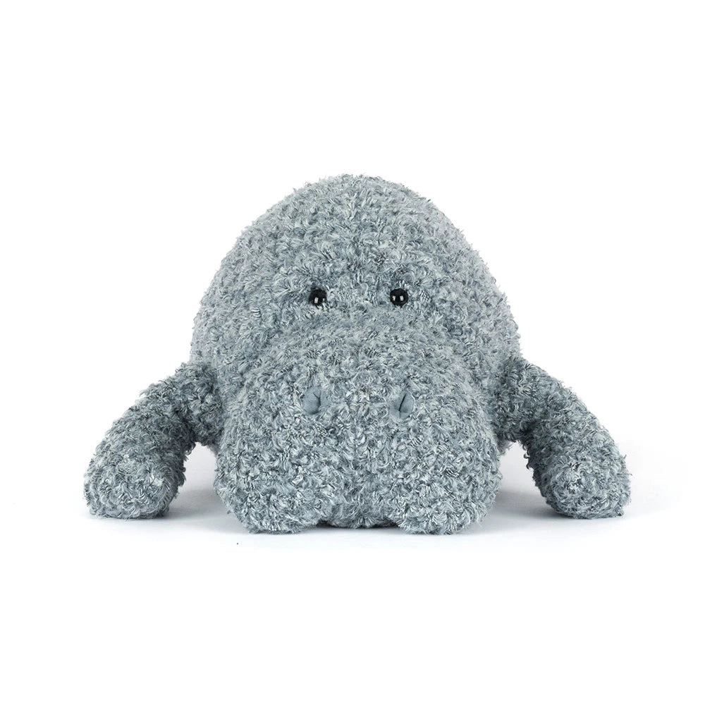 Grey manatee stuffed animal with textured surface on a white background.