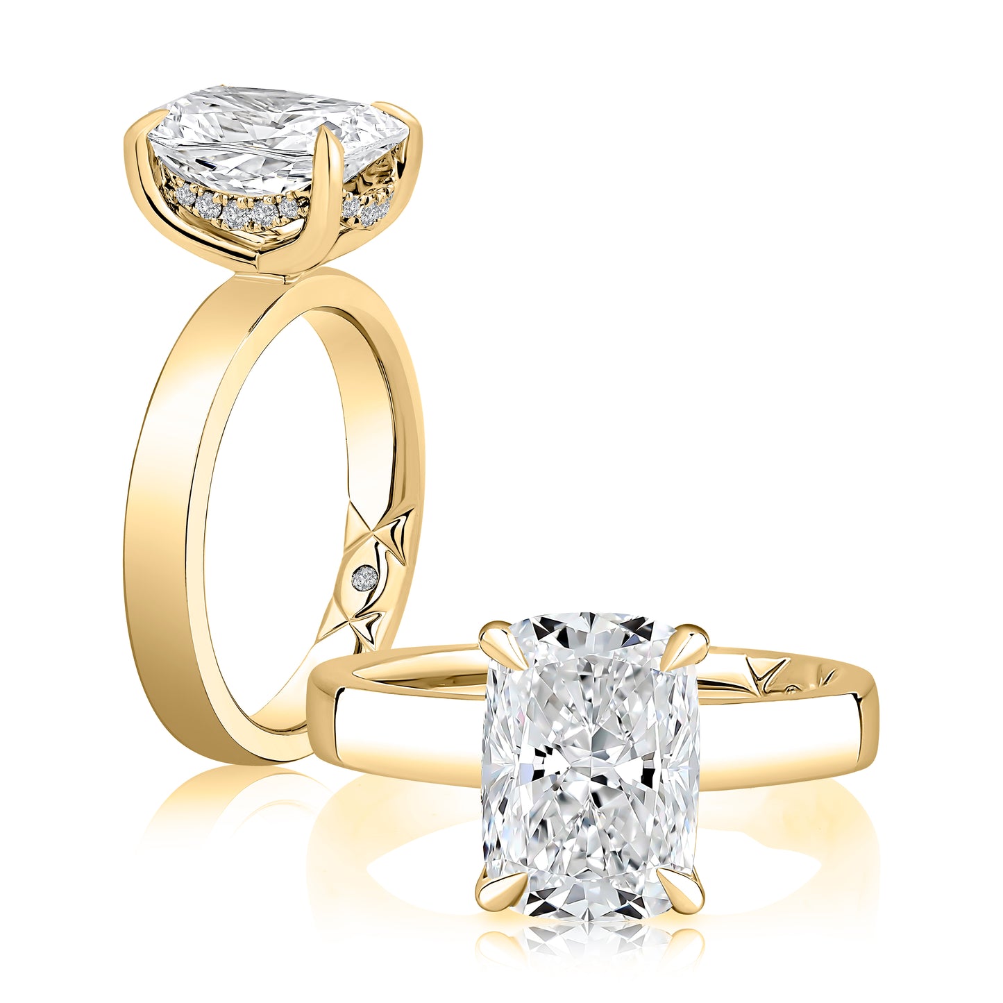 Gold ring with a large diamond and another ring with a smaller diamond on a white background