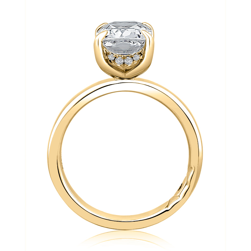 Gold ring with a diamond on a white background
