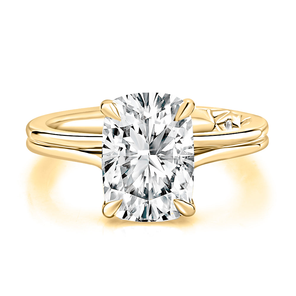 Gold ring with a large diamond on a white background