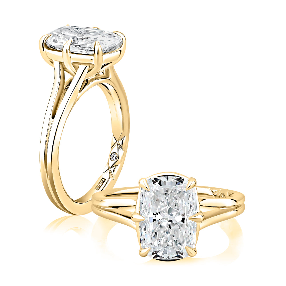Gold ring with a large diamond on a white background