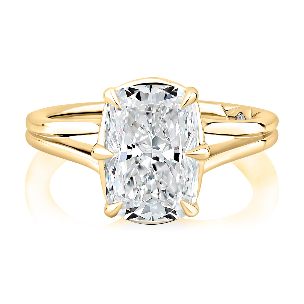 Gold ring with a large diamond on a white background
