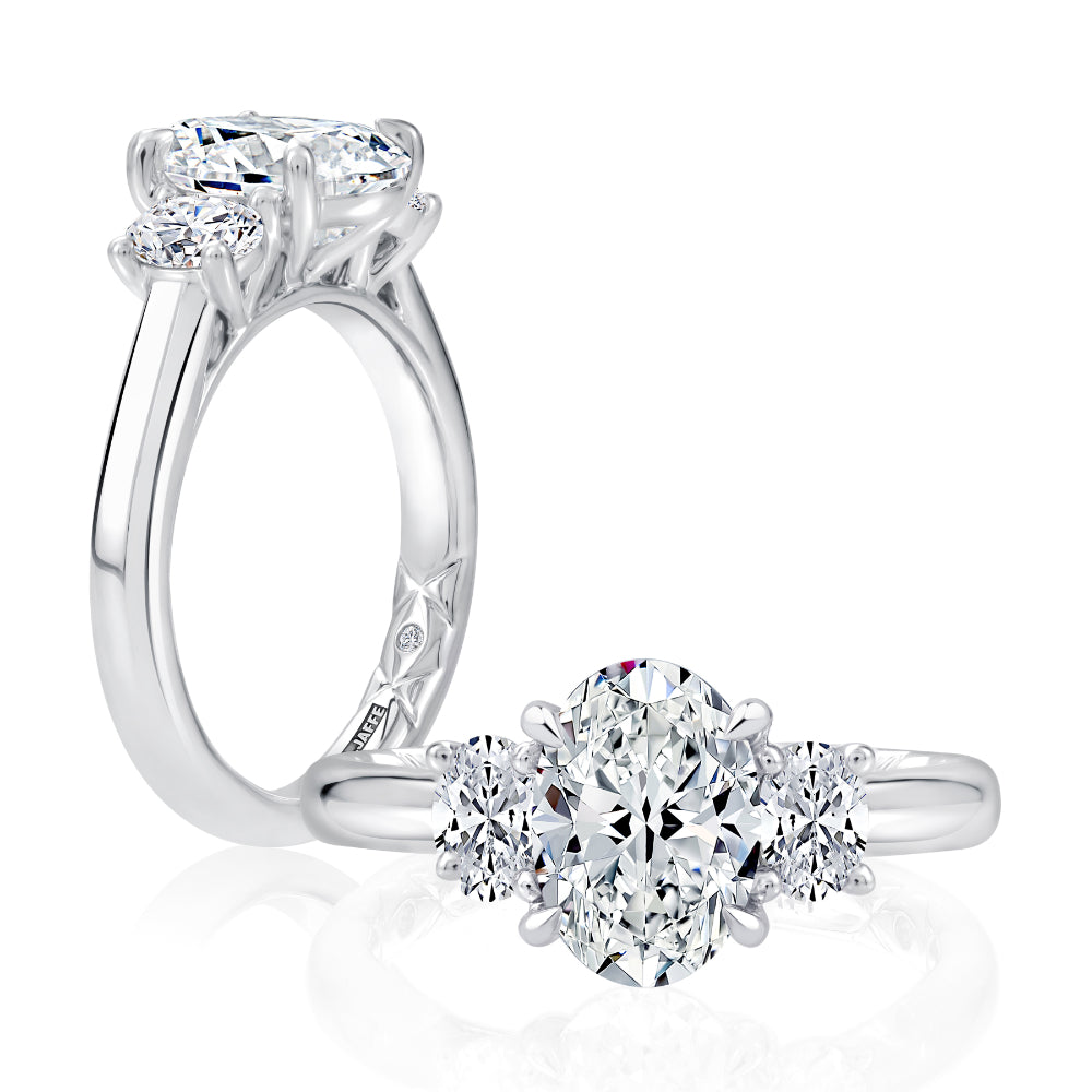 Diamond ring and earring set on a white background