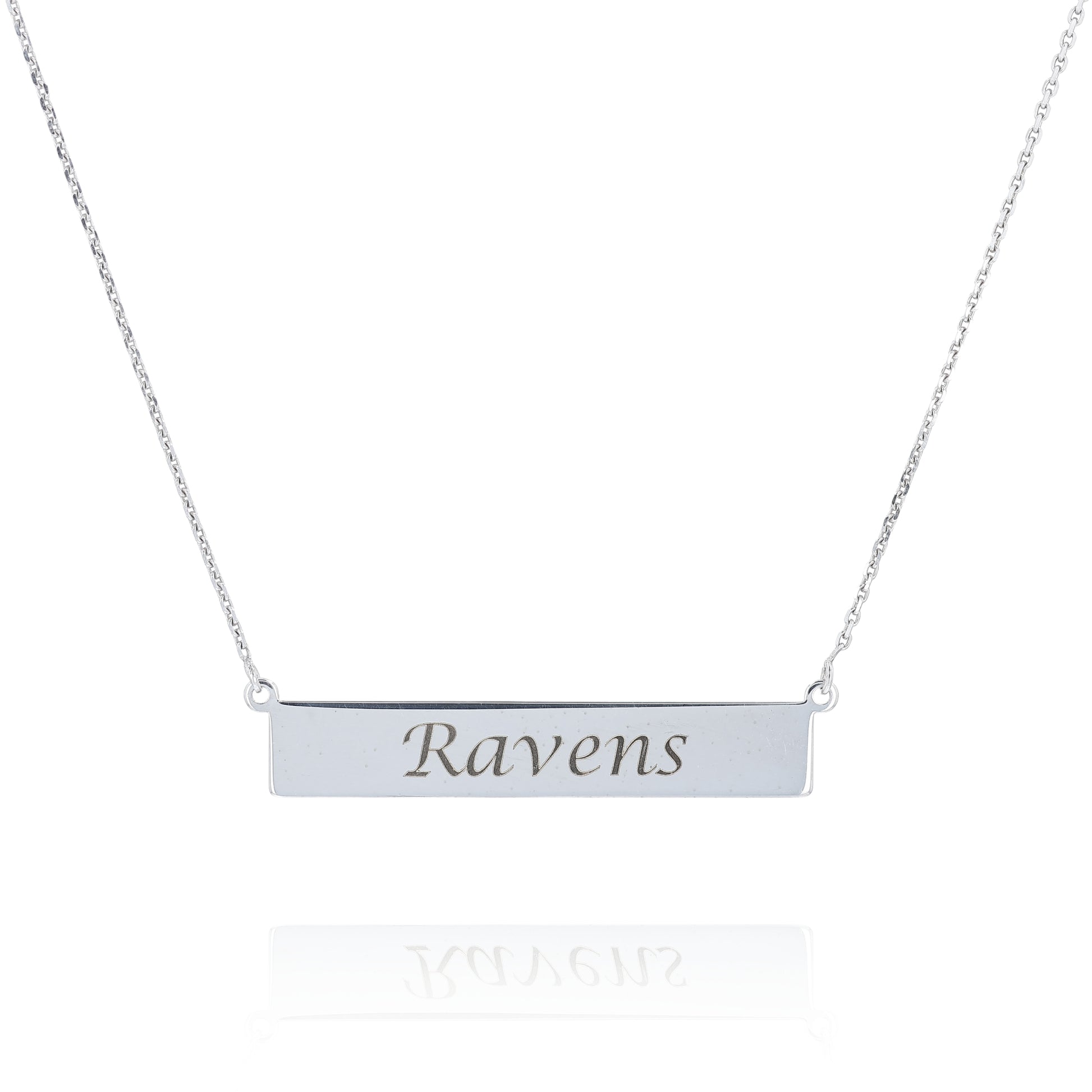 Silver nameplate necklace engraved with the text "Ravens" on a white background